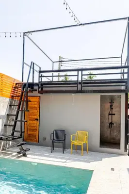 a house with two chairs and a swimming pool at Cactus Villa 2024, Krabi in Klong Muang Beach
