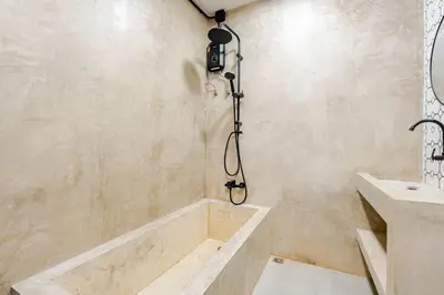 a bathroom with a tub and a sink at Cactus Villa 2024, Krabi in Klong Muang Beach