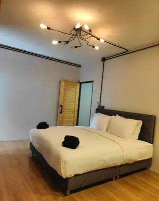 a bedroom with a large bed with a ceiling at Cactus Villa 2024, Krabi in Klong Muang Beach