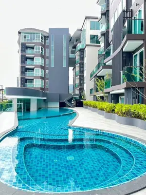 a swimming pool in the middle of a building at 2BR 4Beds Luxury Condo Pool & Fitness in Phuket Town