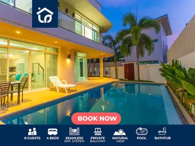 a villa with a swimming pool in front of a house at V129 Walking To Award winning Naiharn Beach 4BR in Rawai Beach