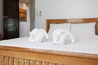 two elephants made out of towels on a bed at V68 Paradise Found 2BR Villa Bliss in rawai in Kata Beach