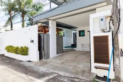 a white house with a gate in front of it at V68 Paradise Found 2BR Villa Bliss in rawai in Kata Beach