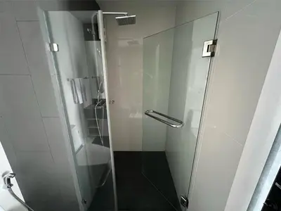 a shower with a glass door in a bathroom at Condo Surin-Bangtao Beach in Surin Beach