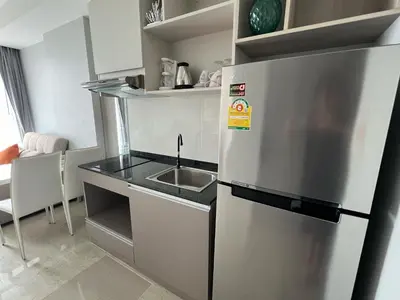 a kitchen with a stainless steel refrigerator and a sink at Condo Surin-Bangtao Beach in Surin Beach