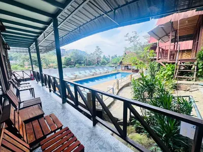 a view from the balcony of a resort with a swimming pool at Phi Phi Treetop in Phi Phi Don