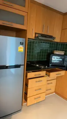 a kitchen with a refrigerator and a microwave at Thebirdhouse Patong Phuket203 in Patong Beach