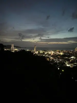 a view of a city at night at Thebirdhouse Patong Phuket203 in Patong Beach