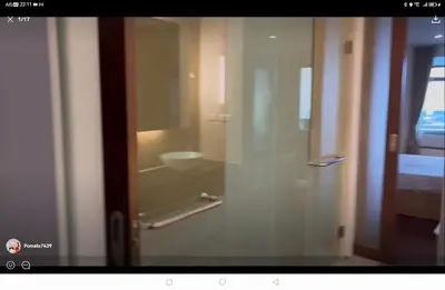 a glass door to a bathroom with a sink at Thebirdhouse Patong Phuket303 in Patong Beach