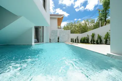 a swimming pool in the backyard of a house at Exclusive 4BR Pool Designer Villa in Lux Pride 2 V6 Residence, Near Laguna in Bang Tao Beach