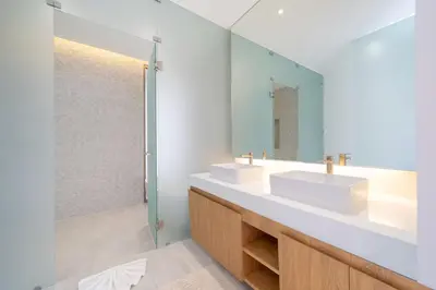 a bathroom with two sinks and a mirror at Exclusive 4BR Pool Designer Villa in Lux Pride 2 V6 Residence, Near Laguna in Bang Tao Beach