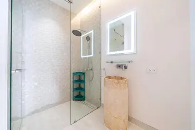 a bathroom with a shower with a glass door at New Build Masterpiece with Private Pool - 4BR Villa in Lux Pride 2 V7 Residence in Bang Tao Beach