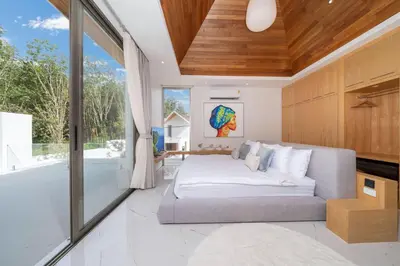 a bedroom with a bed and a bath tub at New Elegance & Tropical Luxury - 4BR Pool Villa in Lux Pride 2 V8 Residence, near Laguna in Bang Tao Beach