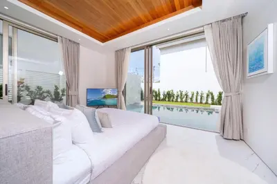 a bedroom with a large bed and a large window at New Elegance & Tropical Luxury - 4BR Pool Villa in Lux Pride 2 V8 Residence, near Laguna in Bang Tao Beach
