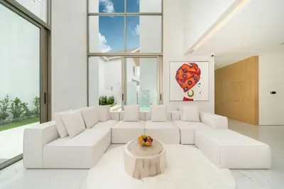 a living room with a white couch and a table at Exclusive Living in Designer 4BR Pool Villa in Lux Pride 2 V11 Residence, Near Laguna in Bang Tao Beach