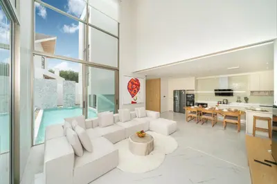 a living room with a white couch and a table at Exclusive Living in Designer 4BR Pool Villa in Lux Pride 2 V11 Residence, Near Laguna in Bang Tao Beach