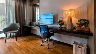 a office with a desk and a chair and a lamp at Cozy studio near Bangtao Beach in Bang Tao Beach