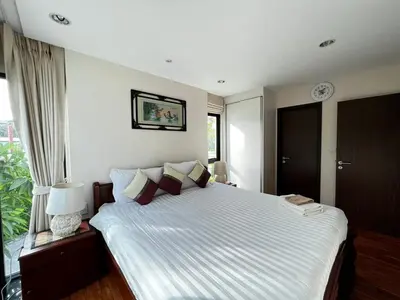 a bedroom with a large bed and a window at Title III Condo Rawai, 1 bedroom in Phuket Town