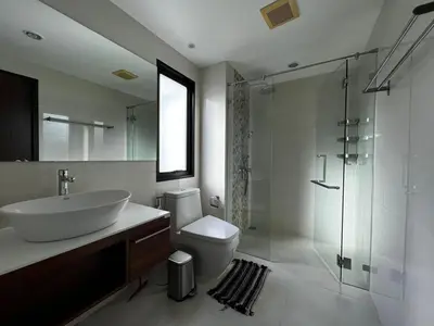 a bathroom with a sink and a toilet and a shower at Title III Condo Rawai, 1 bedroom in Phuket Town
