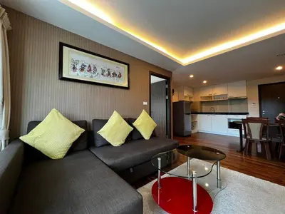 a living room with a couch and a table at Title III Condo Rawai, 1 bedroom in Phuket Town