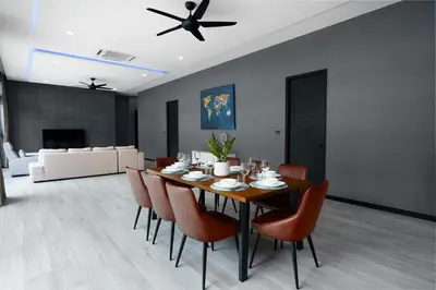 a dining room with a table and chairs at Diamond 1 Villa by G Estate Phuket in Ban Saiyuan (1)