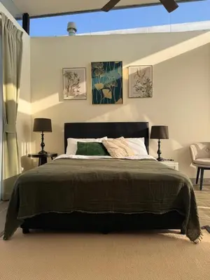 a bedroom with a large bed and two lamps at Laguna Park 3BR Townhouse BangTao in Laguna Phuket