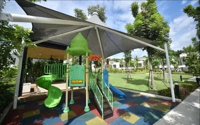 a playground with a slide in a tent at Laguna Park 3BR Townhouse BangTao in Laguna Phuket
