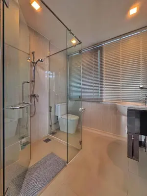 a bathroom with a glass shower stall and a sink at Laguna Park 3BR Townhouse BangTao in Laguna Phuket
