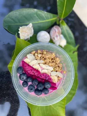 a plastic container with a dessert with blueberries and nuts at Вилла в сердце Пхукета in Surin Beach