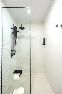 a bathroom with a glass shower with a toilet at ZcapeX2 94-18 by Silqstay in Thalang