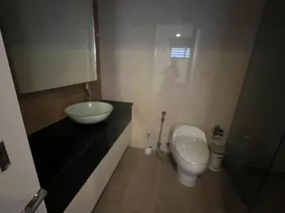 a small bathroom with a toilet and a sink at Thebirdhouse Patong Phuket103 in Patong Beach