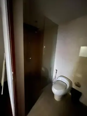 a bathroom with a white toilet in a room at Thebirdhouse Patong Phuket103 in Patong Beach