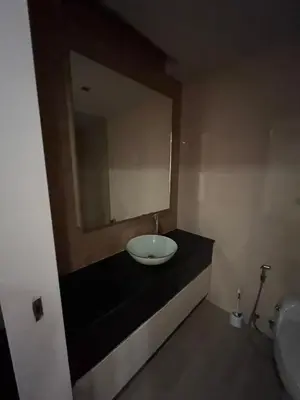 a bathroom with a sink and a mirror at Thebirdhouse Patong Phuket103 in Patong Beach