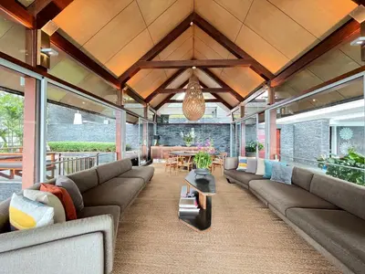 an open living room with couches and a table at Laemsingh Villa 1 - Luxury Villa 5 Bedrooms in Surin Beach