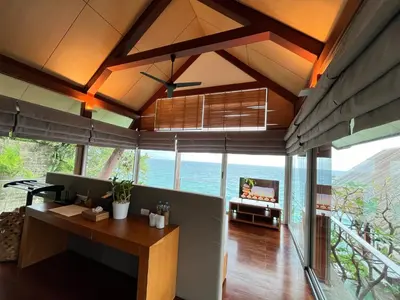 an open living room with a view of the ocean at Laemsingh Villa 1 - Luxury Villa 5 Bedrooms in Surin Beach