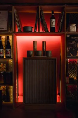 a shelf with a red light in a room at Ḥokma Boutique Hotel & Tropical Lounge in Phi Phi Don