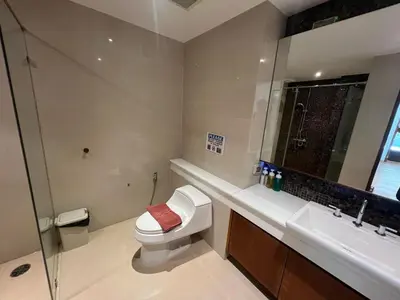 a bathroom with a toilet and a sink at Luxurious 5 Bedroom Condo, private pool, in Patong with Seaview in Patong Beach