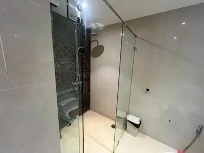 a shower with a glass door in a bathroom at Luxurious 5 Bedroom Condo, private pool, in Patong with Seaview in Patong Beach
