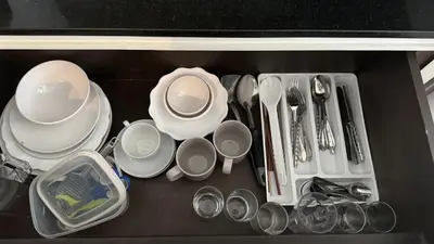 a drawer filled with dishes and utensils at The Regent Bangtao Spacious and comfortable studio at Bang Tao area in Bang Tao Beach