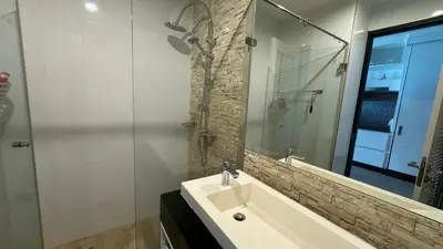 a bathroom with a sink and a mirror at The Regent Bangtao Spacious and comfortable studio at Bang Tao area in Bang Tao Beach