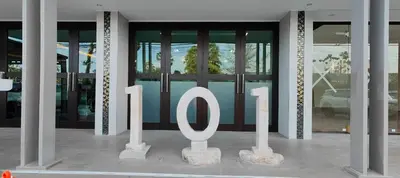 a sign in front of a building with the number at The Regent Bangtao Spacious and comfortable studio at Bang Tao area in Bang Tao Beach