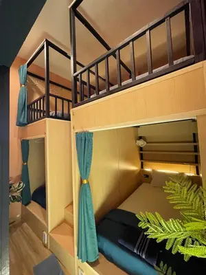 a bunk bed room with two bunk beds at Plearn Phuket Boutique Hostel in Ban Lo Long