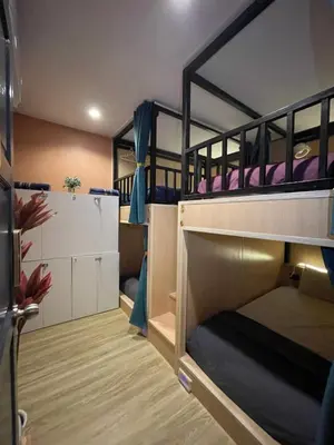 a bunk bed room with two bunk beds at Plearn Phuket Boutique Hostel in Ban Lo Long