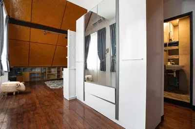 a bathroom with a sliding door leading into a room at Villa Homey in Patong Beach