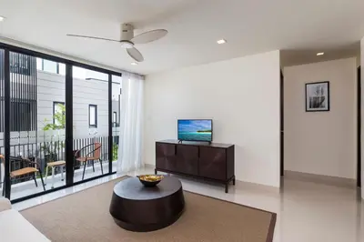 a living room with a couch and a coffee table at Modern 5-Bedroom Pool Villa in Laguna Phuket