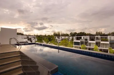 a swimming pool on the roof of a building at Modern 5-Bedroom Pool Villa in Laguna Phuket