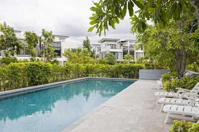 an image of a swimming pool in front of a building at Modern 5-Bedroom Pool Villa in Laguna Phuket