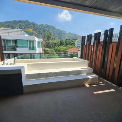 a balcony with a bench on top of a building at Luxury 2 Bedroom Duplex with Private Pool- Privilege Residence Patong in Patong Beach