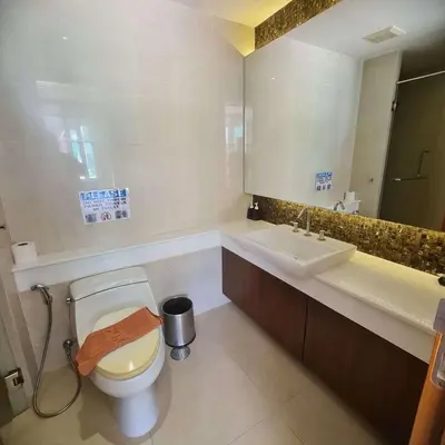 a bathroom with a toilet and a sink at Luxury 2 Bedroom Duplex with Private Pool- Privilege Residence Patong in Patong Beach