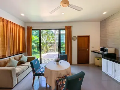 a living room with a couch and a table at Villa Intira 5 bedrooms with 12m private pool and garden in Rawai Beach